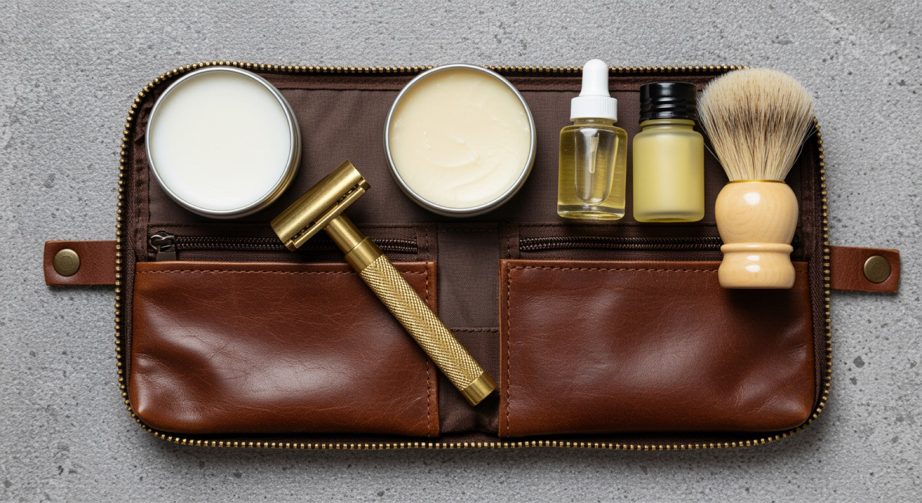 TSA-approved travel shaving kit with cartridge razor, safety razor, shaving soap puck, and travel-size aftershave on a wooden surface
